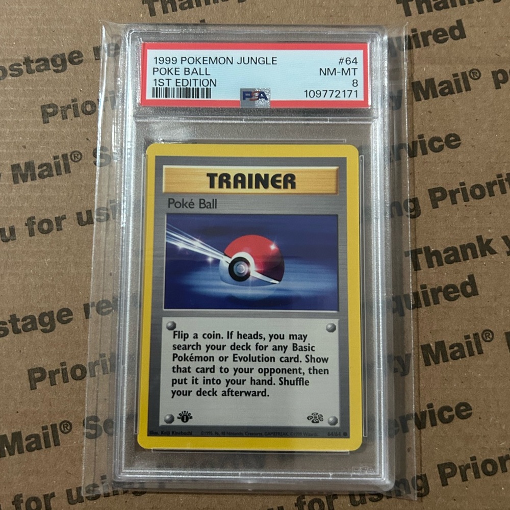 PSA 8 ‘99 Pokemon Poke Ball 1st Edition Card No. 64